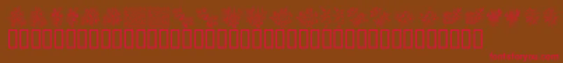 フォントKrFloralColorMe – 赤い文字が茶色の背景にあります。