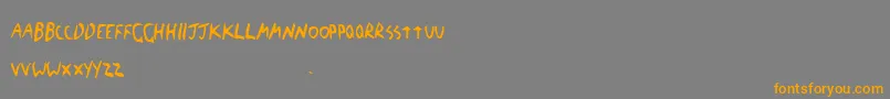 フォントTheBlickFont – オレンジの文字は灰色の背景にあります。