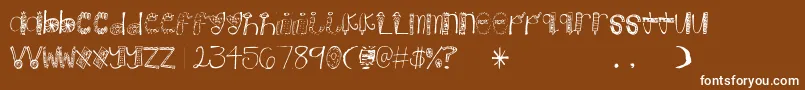 Weitere Informationen zur Candy-Schriftart Candy-Schriftart – Weiße Schriften auf braunem Hintergrund
