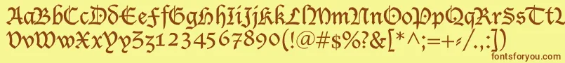 フォントShablon – 茶色の文字が黄色の背景にあります。