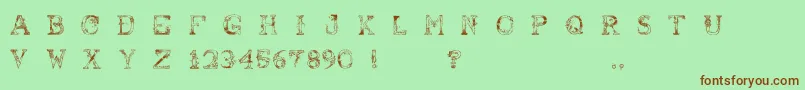 フォントAbusivePencil – 緑の背景に茶色のフォント