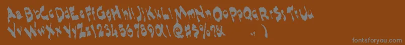 Shlophappyremix-Schriftart – Graue Schriften auf braunem Hintergrund