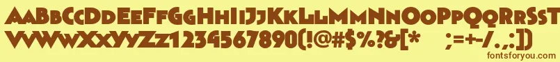 フォントBahnhofultra – 茶色の文字が黄色の背景にあります。