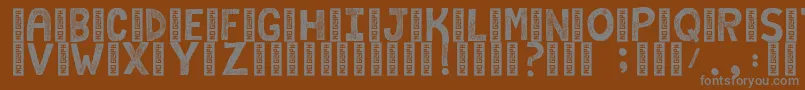 CampkidzByRatticsassin Font – Gray Fonts on Brown Background