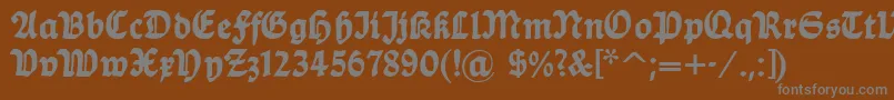 フォントDsballade – 茶色の背景に灰色の文字