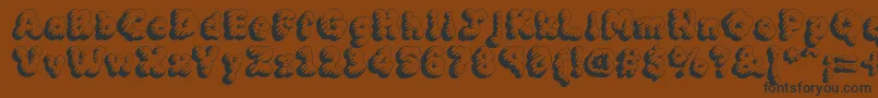 Mcklt Font – Black Fonts on Brown Background