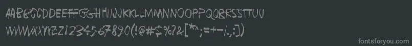 フォントFugaDeCerebros – 黒い背景に灰色の文字