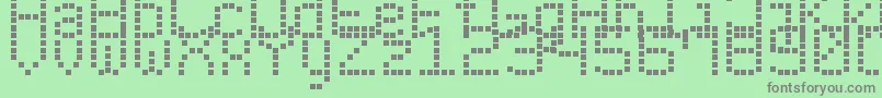 フォントModernLedBoard7 – 緑の背景に灰色の文字