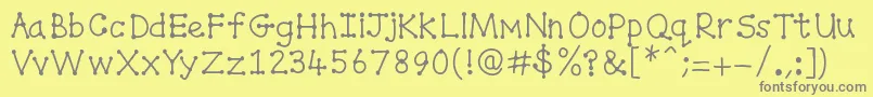 Spottydottie-Schriftart – Graue Schriften auf gelbem Hintergrund