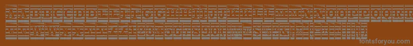 フォントATrianglercmmr – 茶色の背景に灰色の文字