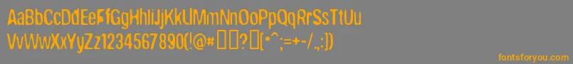 フォントBrokenWing – オレンジの文字は灰色の背景にあります。