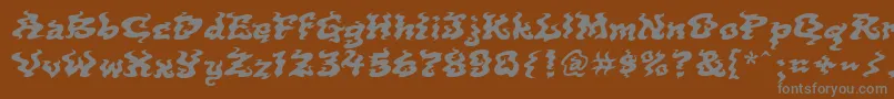 Incense-fontti – harmaat kirjasimet ruskealla taustalla