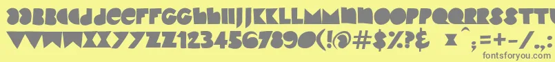 KinkyVbeta2-Schriftart – Graue Schriften auf gelbem Hintergrund