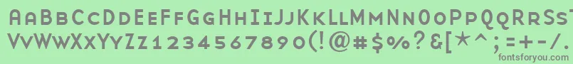 BaseninesmallcapsRegular-fontti – harmaat kirjasimet vihreällä taustalla