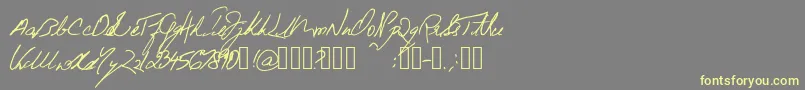 BeneathTheFloorboards Font – Yellow Fonts on Gray Background