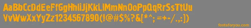 フォントGraffiti1c – オレンジの文字は灰色の背景にあります。
