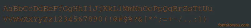 PcCharsetRegular-Schriftart – Braune Schriften auf schwarzem Hintergrund