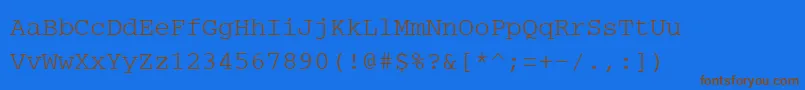 フォントPcCharsetRegular – 茶色の文字が青い背景にあります。