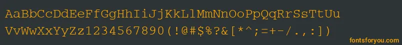PcCharsetRegular-Schriftart – Orangefarbene Schriften auf schwarzem Hintergrund