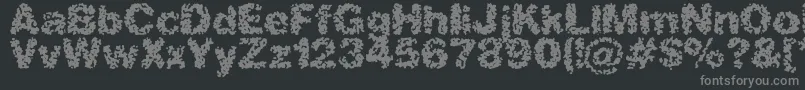 フォントAspastic – 黒い背景に灰色の文字