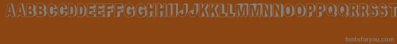CrayonSocialArt-fontti – harmaat kirjasimet ruskealla taustalla