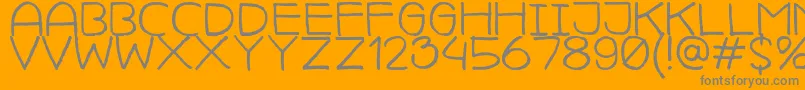 CamillejavalMedium-Schriftart – Graue Schriften auf orangefarbenem Hintergrund