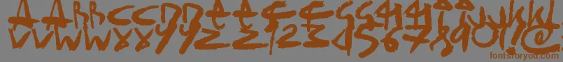 フォントSickSketchlings – 茶色の文字が灰色の背景にあります。