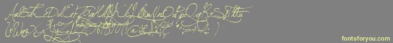 Czcionka JellykaBeesAntiqueHandwriting – żółte czcionki na szarym tle
