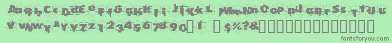 PuzzlePieces-fontti – harmaat kirjasimet vihreällä taustalla