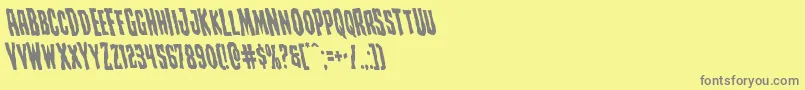 Creepycrawlersleft-fontti – harmaat kirjasimet keltaisella taustalla