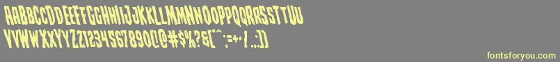 Czcionka Creepycrawlersleft – żółte czcionki na szarym tle