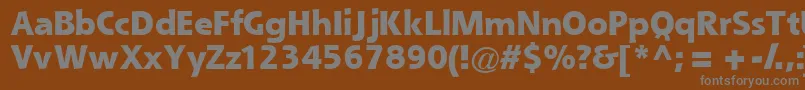 Queblackssk-fontti – harmaat kirjasimet ruskealla taustalla