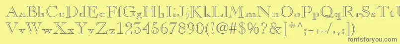 フォントCasprofn – 黄色の背景に灰色の文字