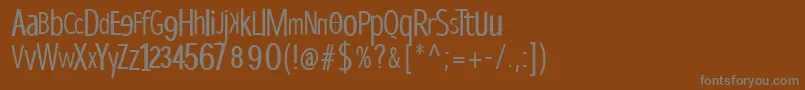 フォントDispropsans – 茶色の背景に灰色の文字