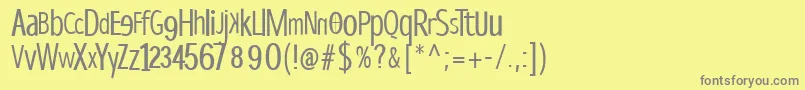 Dispropsans-fontti – harmaat kirjasimet keltaisella taustalla