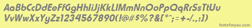 HammerfatItalic-fontti – harmaat kirjasimet keltaisella taustalla