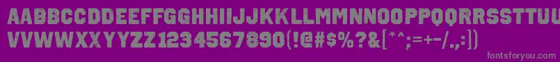 OctinvintageablRegular-fontti – harmaat kirjasimet violetilla taustalla