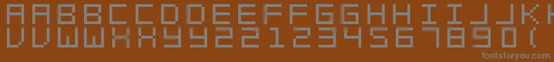 SwftV02-fontti – harmaat kirjasimet ruskealla taustalla