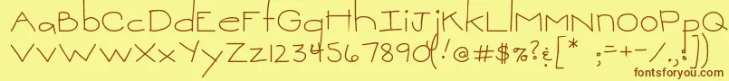 フォントMtfSweetie – 茶色の文字が黄色の背景にあります。