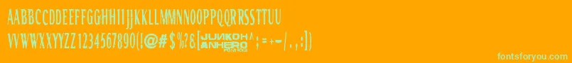 Rgmb6044Str-Schriftart – Grüne Schriften auf orangefarbenem Hintergrund