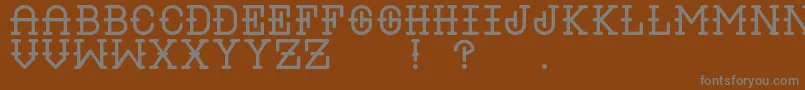 LiquorRegular-Schriftart – Graue Schriften auf braunem Hintergrund