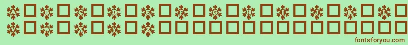 Snowycaps Font – Brown Fonts on Green Background