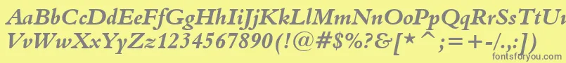 Aldine401BoldItalicBt-fontti – harmaat kirjasimet keltaisella taustalla