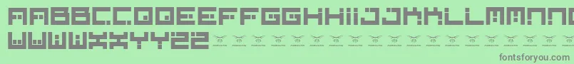 Digitalfirebomb-fontti – harmaat kirjasimet vihreällä taustalla