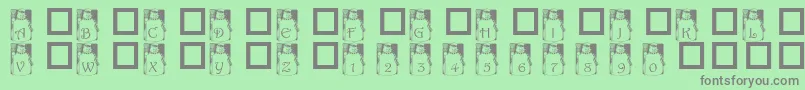 フォントPfSnowman1 – 緑の背景に灰色の文字