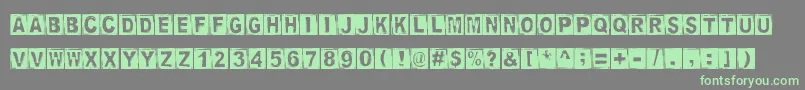 StampedDsg Font – Green Fonts on Gray Background