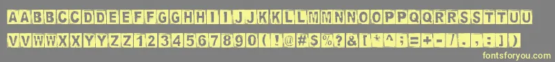 StampedDsg Font – Yellow Fonts on Gray Background