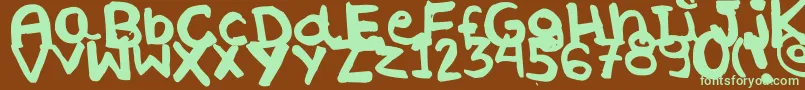 WhateverByLucianaMorin-fontti – vihreät fontit ruskealla taustalla