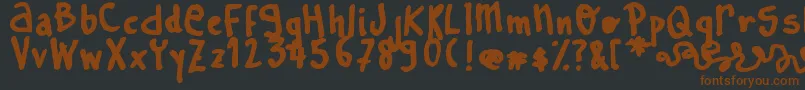Шрифт LearnToSpell – коричневые шрифты на чёрном фоне