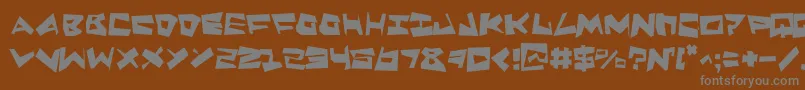 QuakeShakeSupermax-Schriftart – Graue Schriften auf braunem Hintergrund
